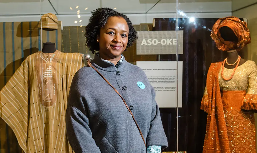 Making real changes in collections development A curator in front of display of African costume