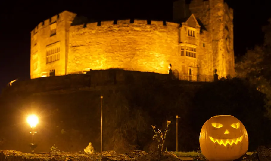 25 years: UK’s top 10 haunted historic sites named this Halloween Tamworth castle at night with jack o'lantern