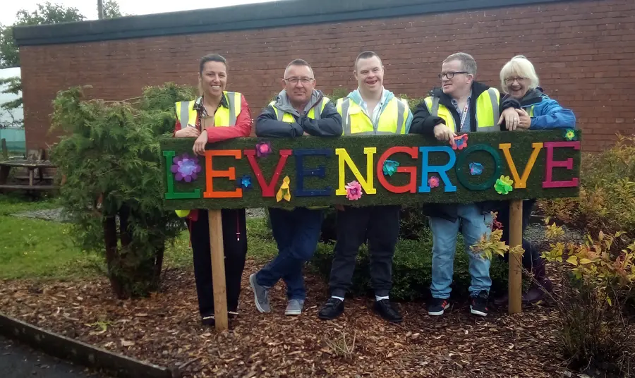 Levengrove Park: a place for recovery Group stand around park sign