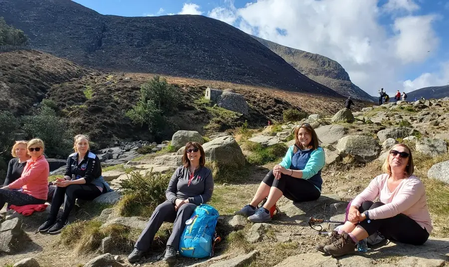 NHS nurses sitting down with Slieve Donard in the background