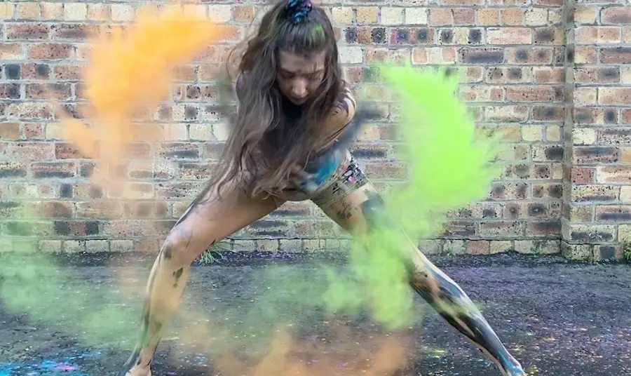 A young Shaper/Caper dancer A young Shaper/Caper dancer from Dundee performs with coloured, powdered paint