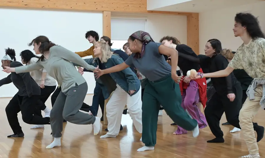 Clod Ensemble A group of people are in a studio taking part in a movement and dance workshop