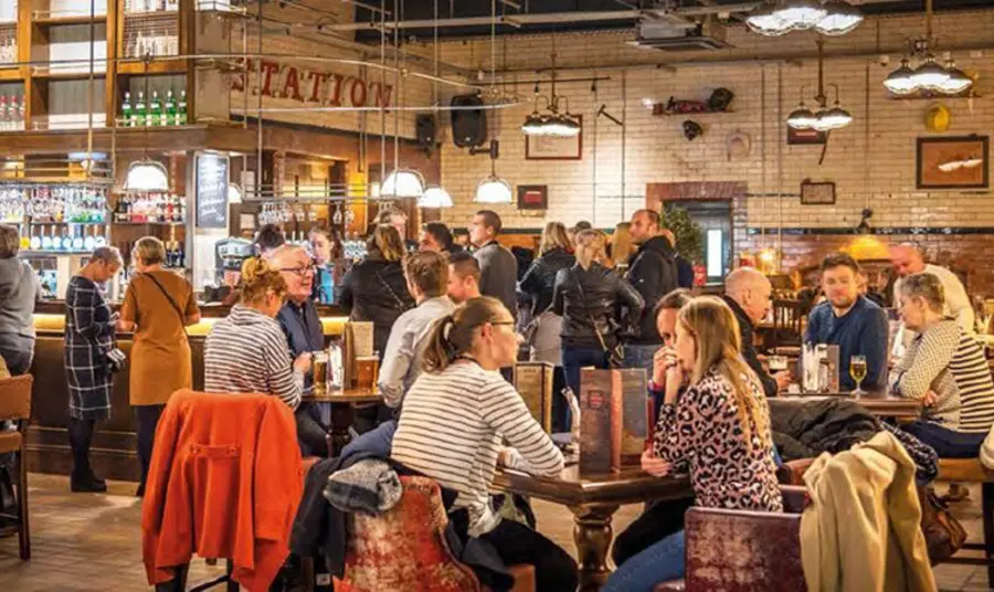 New funding for enterprise and business skills training programmes A well lit, crowded bar with people sitting at tables