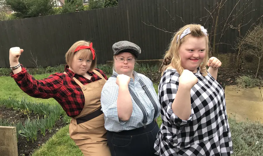 Three young people in war era clothing