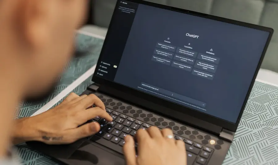 A person at a laptop using the AI Chat GPT