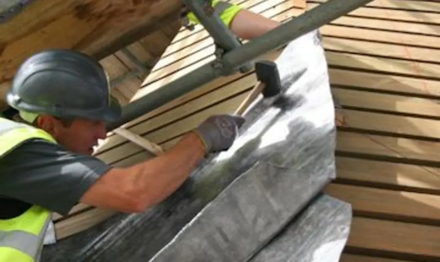 A man repairs the roof at Canterbury Cathedral A man repairs the roof at Canterbury Cathedral