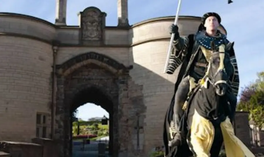 A horseman in costume rides out of Nottingham Castle A horseman in costume rides out of Nottingham Castle