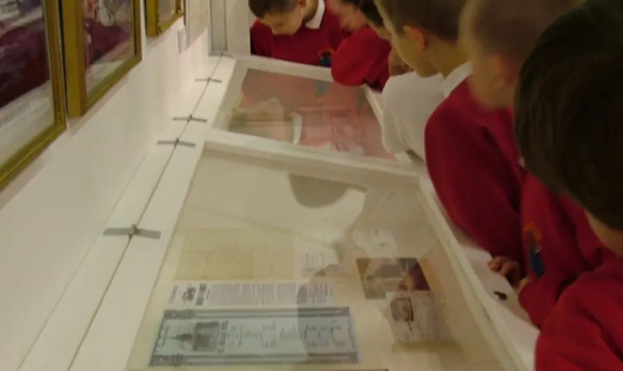 Cotton Threads: Bury's Industrial Links Children exploring an exhibition at Bury Art Museum