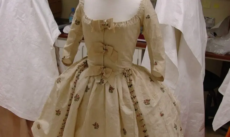 Revealing Costume through the Centuries A crinoline-style skirt and matching bodice, in white cotton gauze with extensive beetle wing embroidery