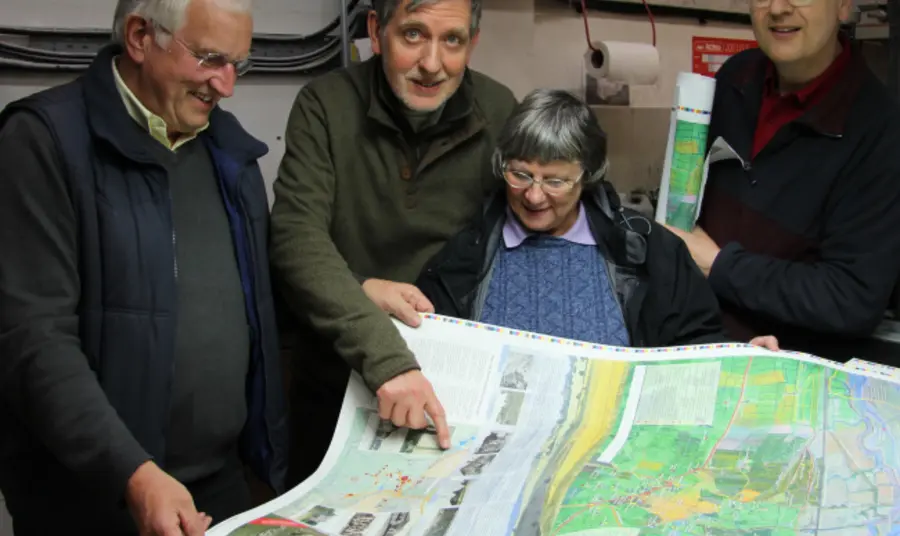 Creating a pictorial historical record of South East Essex - "All Our Stories" Volunteers from the Hadleigh and Thundersley Community Archive Group examine a walking map