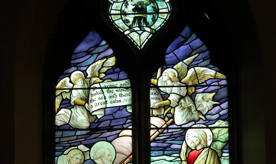 Restoration of stained glass windows and associated mullions and masonry of Grade II Listed Church The newly repaired window