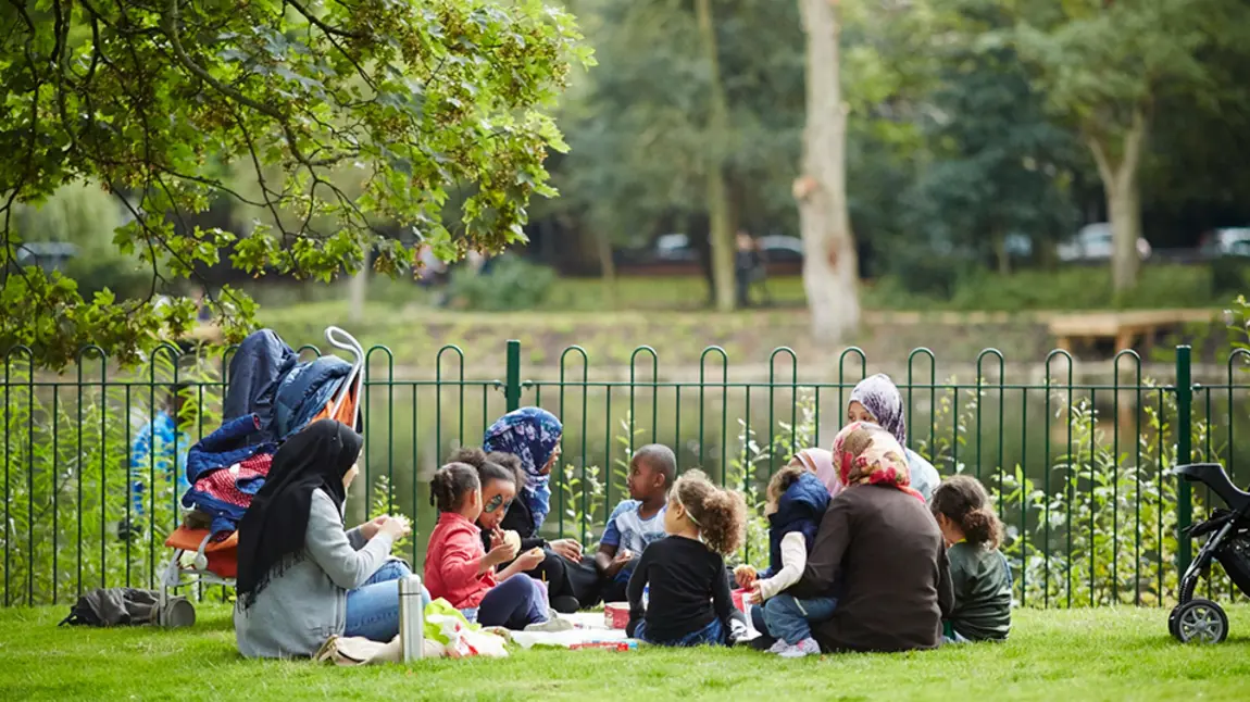 Family having a picnic in a park