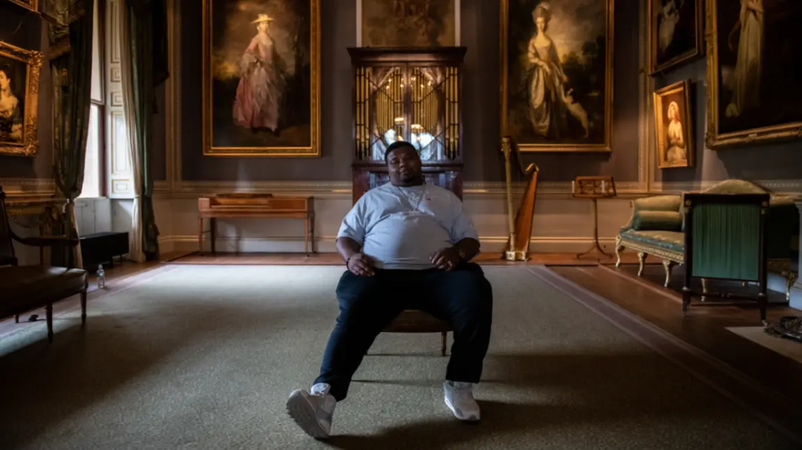 25 years: Stars launch free offers for National Lottery players Big Narstie sitting in Kenwood House