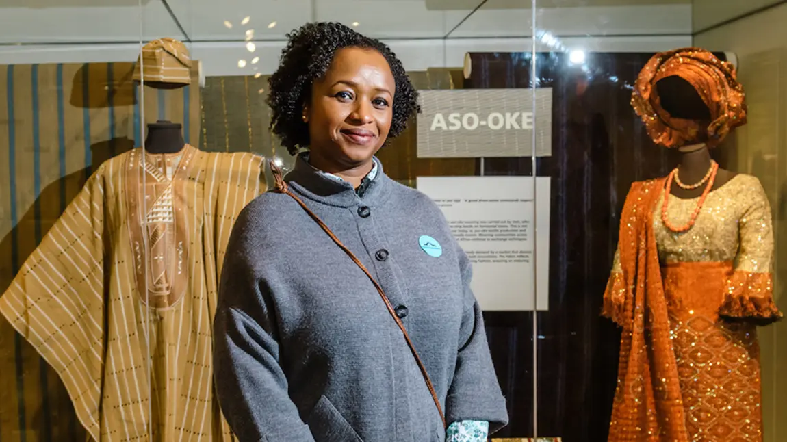 Making real changes in collections development A curator in front of display of African costume