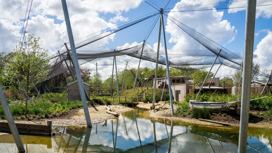 The Waterscapes Aviary at Slimbridge. Large aviary with netting at Slimbridge Wetland Centre