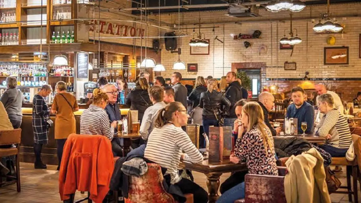 New funding for enterprise and business skills training programmes A well lit, crowded bar with people sitting at tables