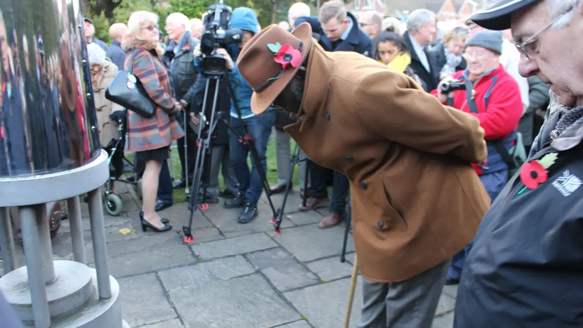 Changing lives: Johnson digs deep and reunites with mining colleagues Man at memorial event