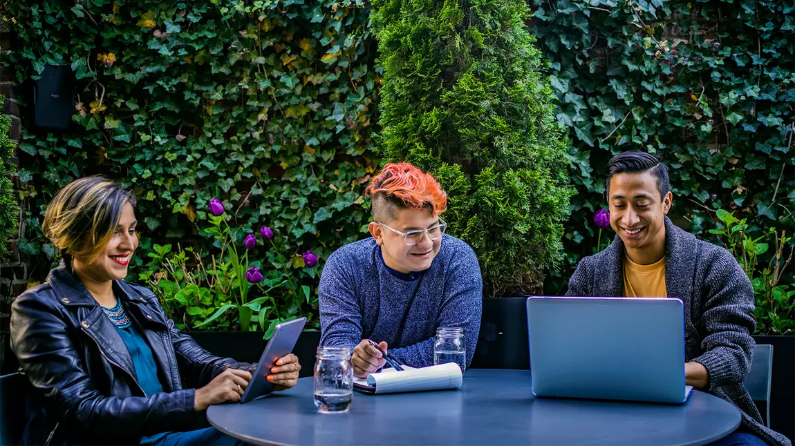 Organisations sought to deliver digital skills projects Three people using laptop and tablet