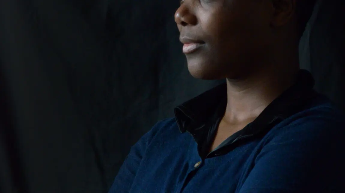 Ruth rediscovered her love of poetry A woman in blue top against a black background