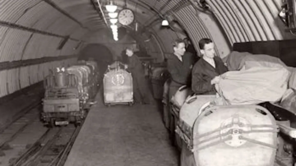 People sort post on the subterranean Mail Rail train People sort post on the subterranean Mail Rail train
