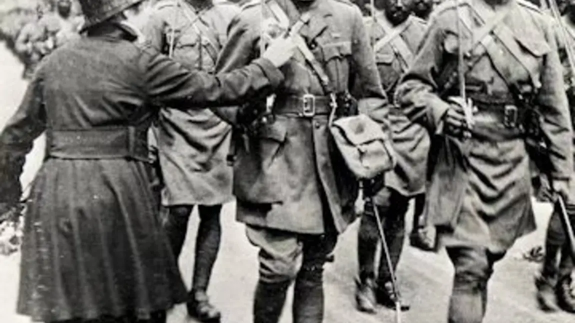 A lady pinning a flower onto a Sikh soldier in 1916 A lady pinning a flower onto a Sikh soldier in 1916