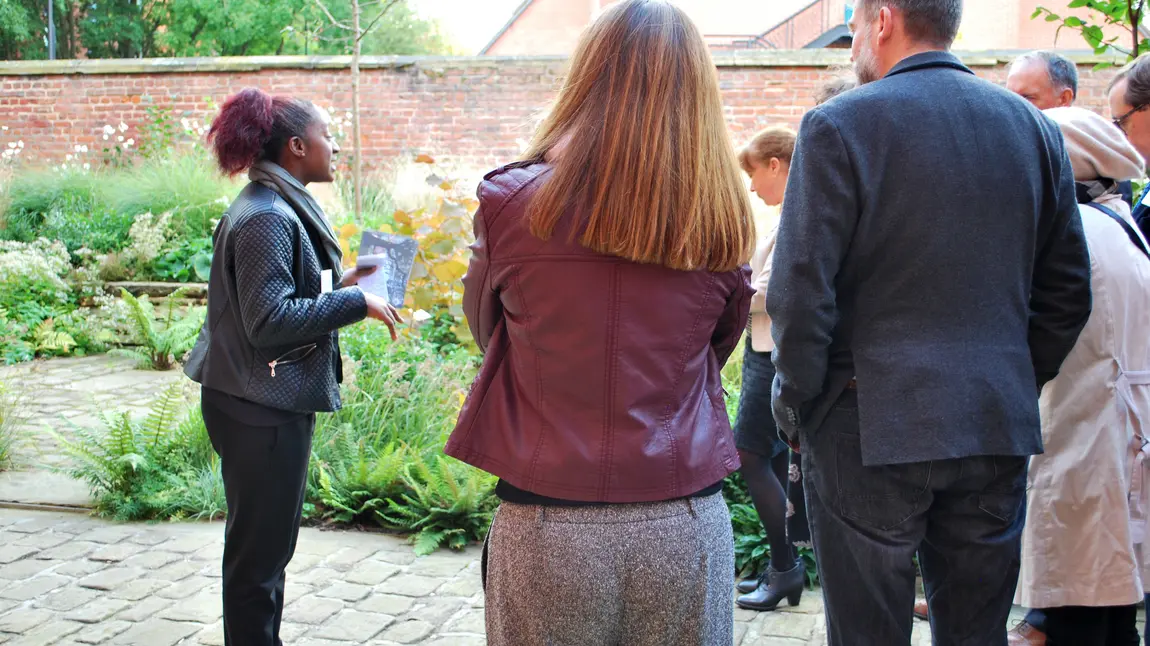 Francine Hayfron, cultural park keeper, leads a tour of the Whitworth garden A woman gives a tour of a garden